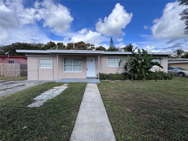 view of front of home with a front yard