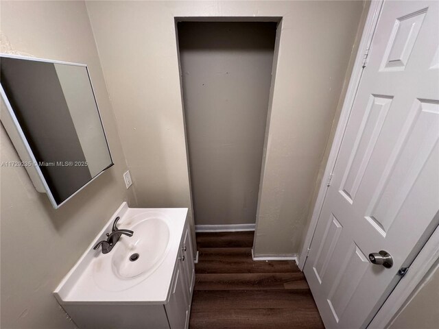 bathroom featuring hardwood / wood-style flooring and vanity