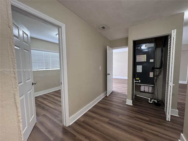 hallway with dark hardwood / wood-style floors