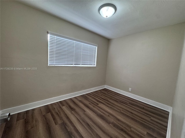 empty room featuring dark hardwood / wood-style floors