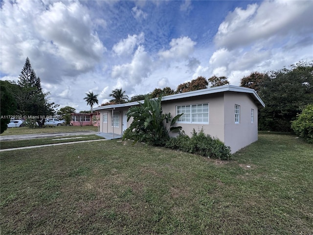 ranch-style home with a front lawn