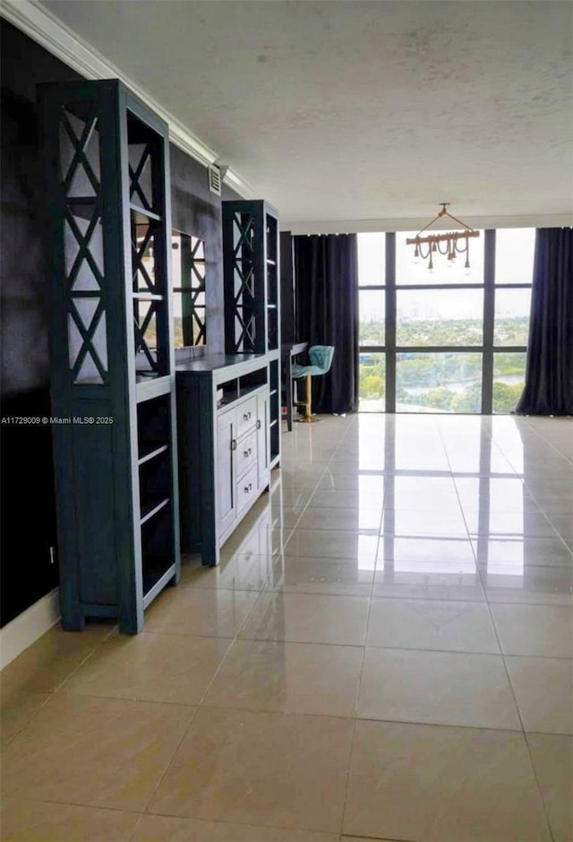 interior space featuring expansive windows and light tile patterned flooring