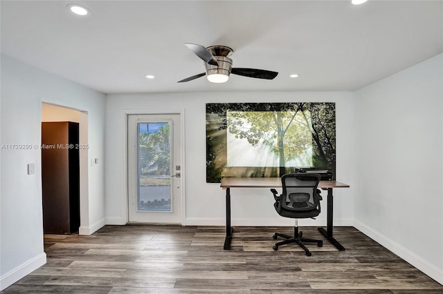 office area with wood-type flooring, a wealth of natural light, and ceiling fan