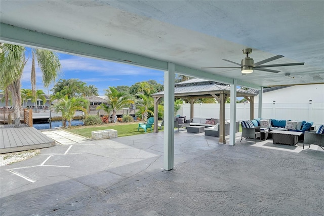 view of patio / terrace with ceiling fan, an outdoor hangout area, and a gazebo