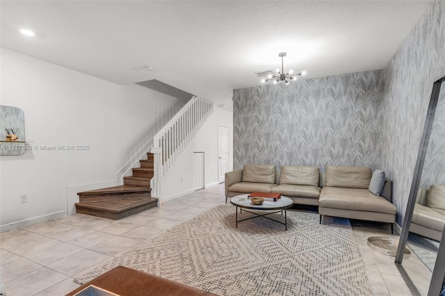 living room featuring light tile patterned floors and a chandelier