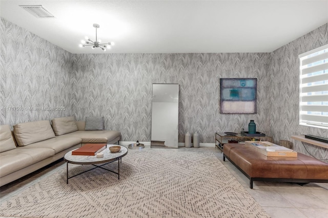 tiled living room featuring a chandelier