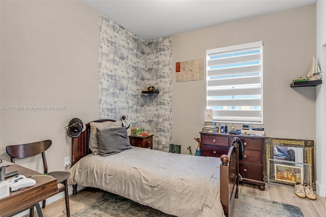 bedroom featuring wood-type flooring