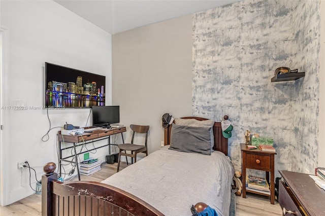 bedroom with light hardwood / wood-style flooring