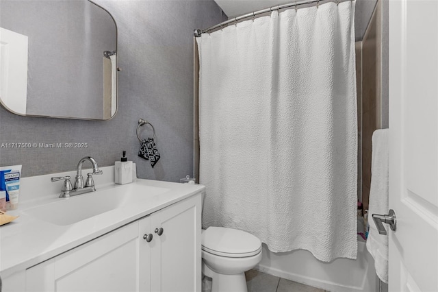 full bathroom featuring toilet, vanity, tile patterned floors, and shower / bath combination with curtain