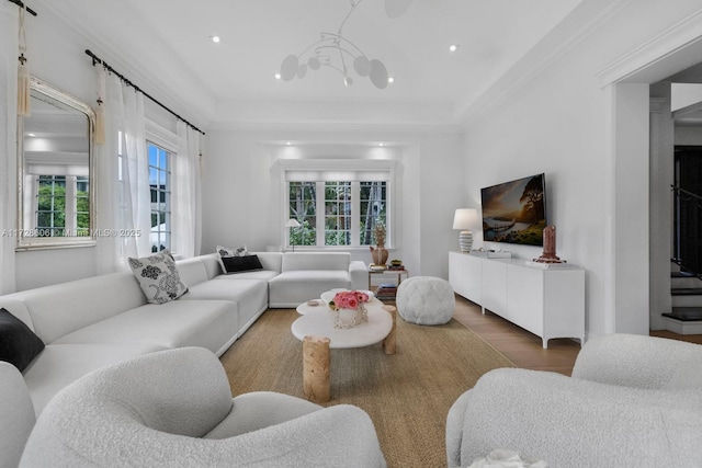 living room featuring an inviting chandelier and hardwood / wood-style flooring