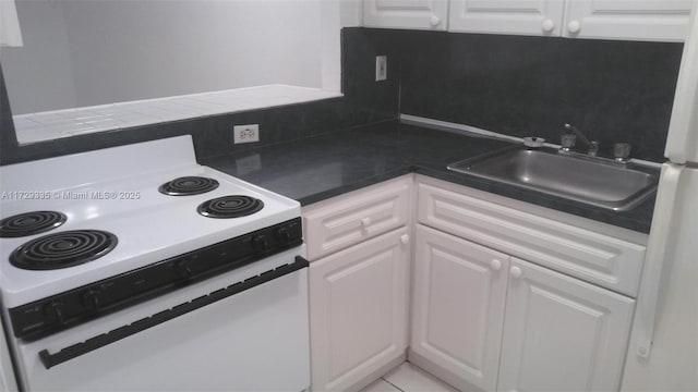 kitchen with white cabinets, range with electric cooktop, and sink