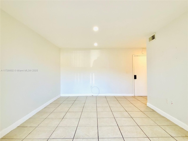 spare room featuring light tile patterned floors