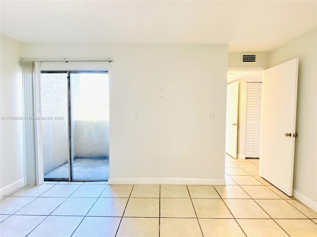 view of tiled spare room