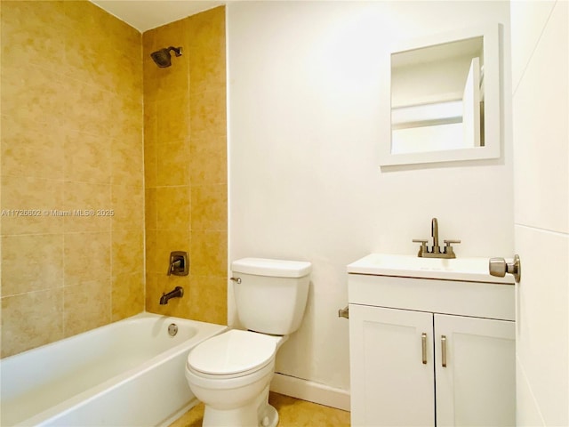 full bathroom with toilet, tiled shower / bath combo, and vanity