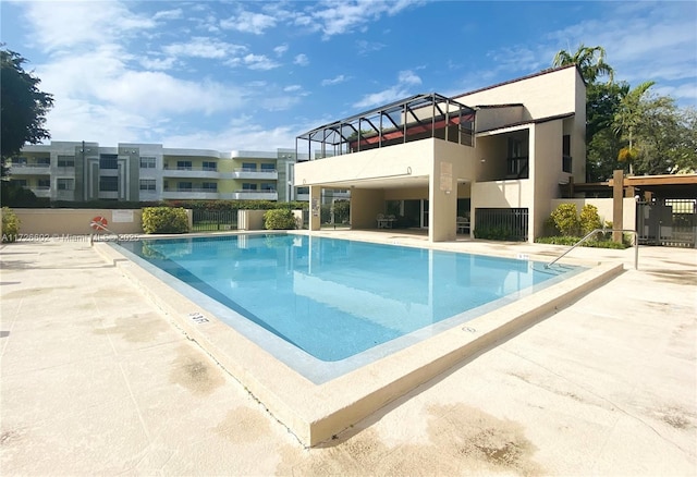 view of swimming pool with a patio area