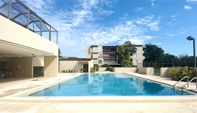 view of swimming pool featuring a patio area