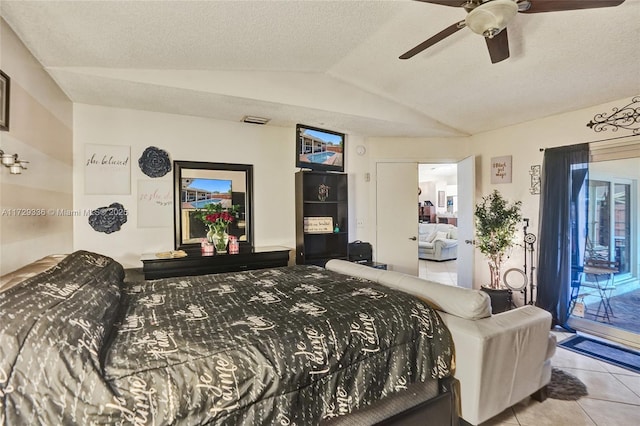 bedroom featuring lofted ceiling, a textured ceiling, light tile patterned floors, ceiling fan, and access to exterior