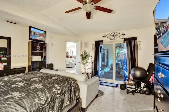 bedroom with vaulted ceiling, light tile patterned flooring, access to exterior, ceiling fan, and a textured ceiling