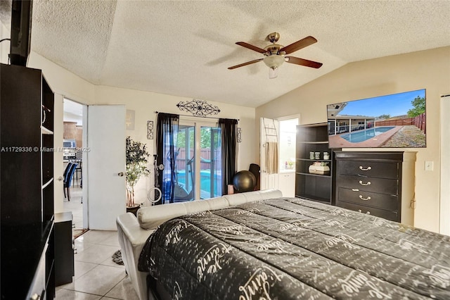 tiled bedroom featuring lofted ceiling, access to outside, a textured ceiling, and ceiling fan