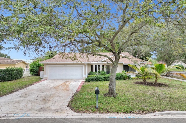 ranch-style home featuring a garage and a front yard