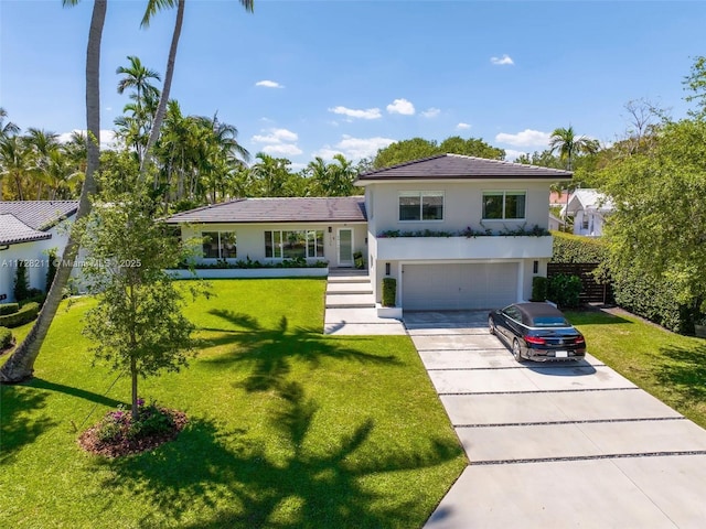 view of front facade featuring a garage, a front lawn, concrete driveway, and stucco siding