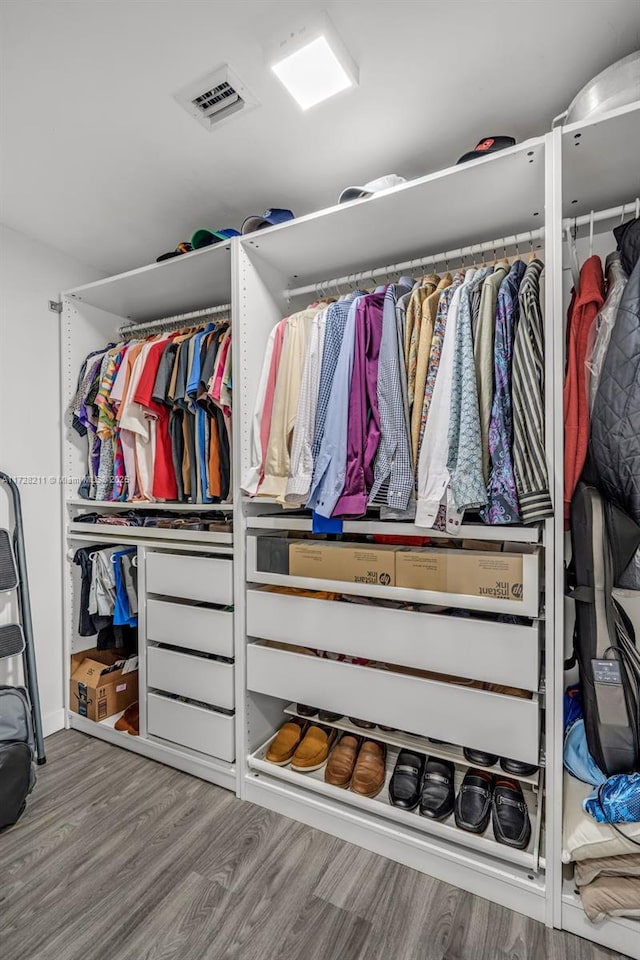 spacious closet featuring visible vents and light wood-style floors