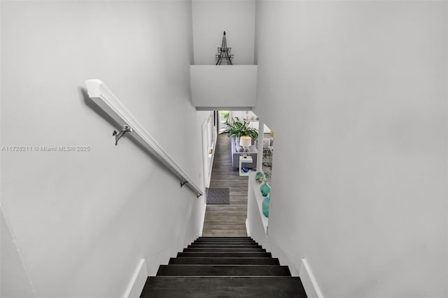stairs with wood finished floors