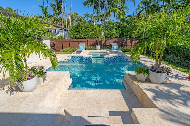 view of swimming pool with an in ground hot tub, a patio, a fenced backyard, and a fenced in pool