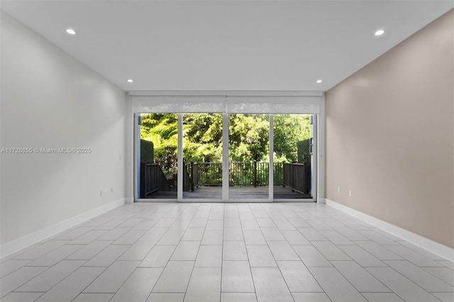 spare room featuring light tile patterned floors