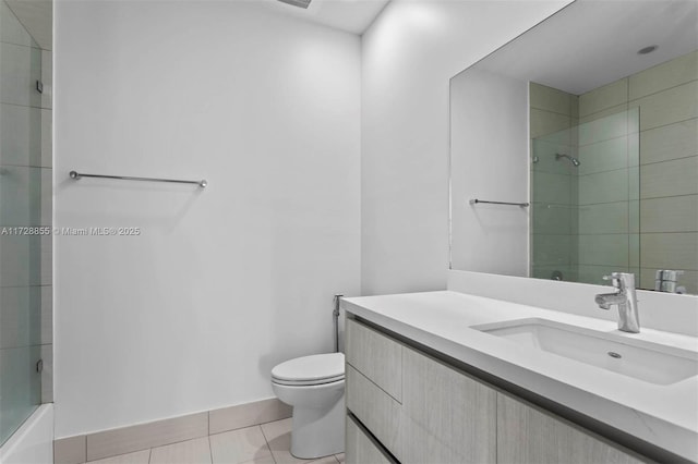 full bathroom featuring tile patterned floors, vanity, toilet, and combined bath / shower with glass door