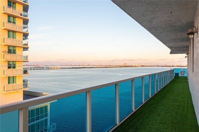 balcony at dusk with a water view