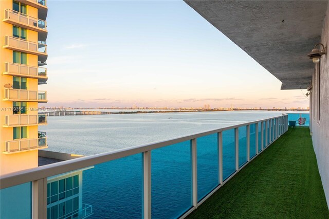700 NE 25th St Unit 1003, Miami, FL 33137 - balcony at dusk with a water view