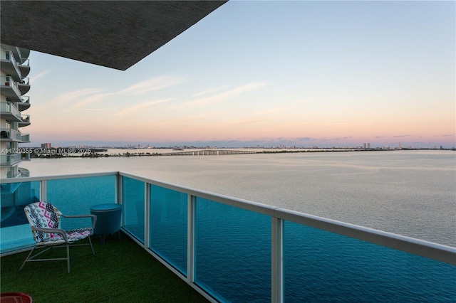 balcony at dusk with a water view