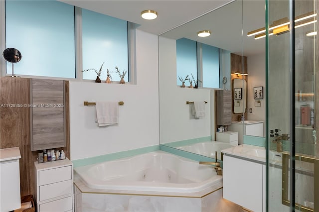 bathroom with shower with separate bathtub and vanity