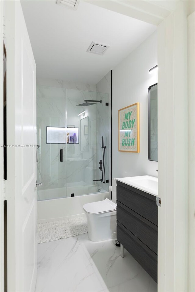 700 NE 25th St Unit 1003, Miami, FL 33137 - full bathroom with combined bath / shower with glass door, vanity, and toilet