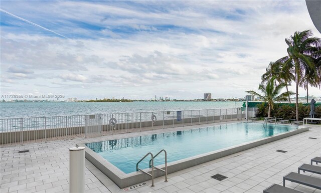 700 NE 25th St Unit 1003, Miami, FL 33137 - view of pool featuring a patio and a water view