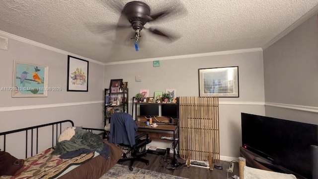 bedroom featuring crown molding, a textured ceiling, ceiling fan, and hardwood / wood-style flooring