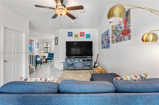 living room featuring ceiling fan and light tile patterned floors