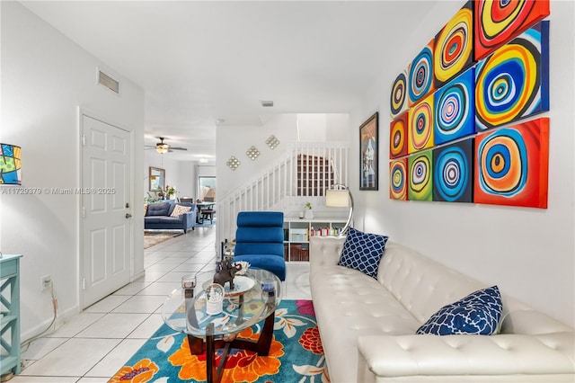 tiled living room featuring ceiling fan