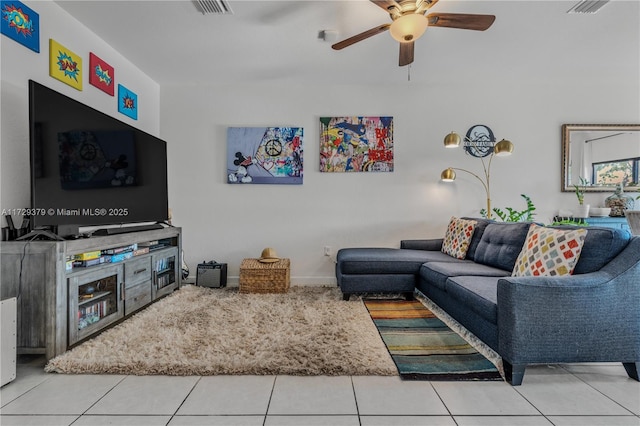 tiled living room featuring ceiling fan