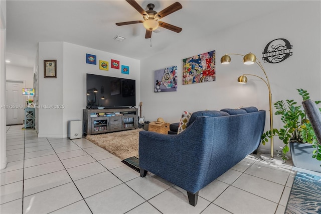 tiled living room with ceiling fan