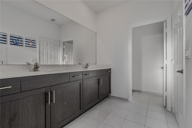 bathroom featuring tile patterned floors and vanity