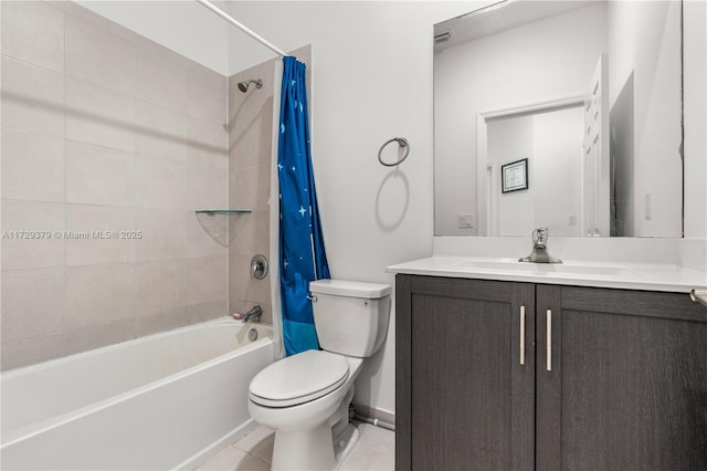 full bathroom with tile patterned floors, toilet, vanity, and shower / tub combo