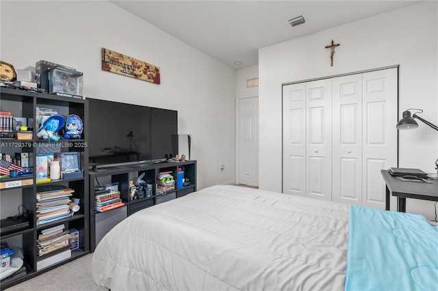 bedroom featuring a closet and carpet floors