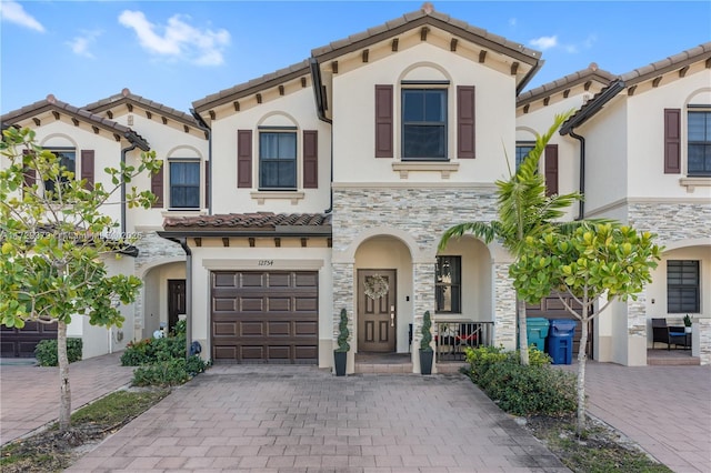 mediterranean / spanish house featuring a garage