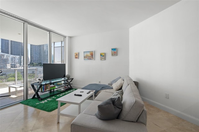 tiled living room featuring a wall of windows