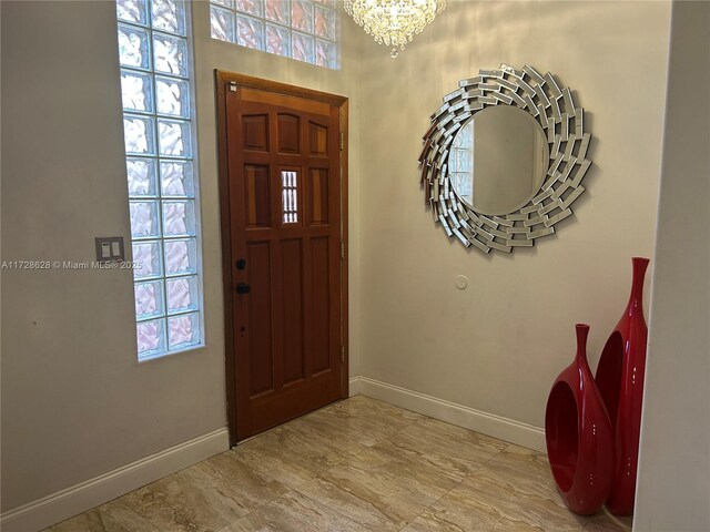 entrance foyer with a notable chandelier