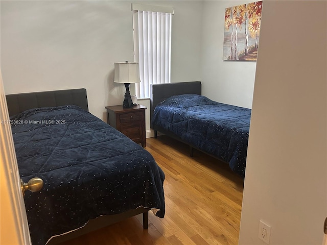 bedroom with light hardwood / wood-style floors