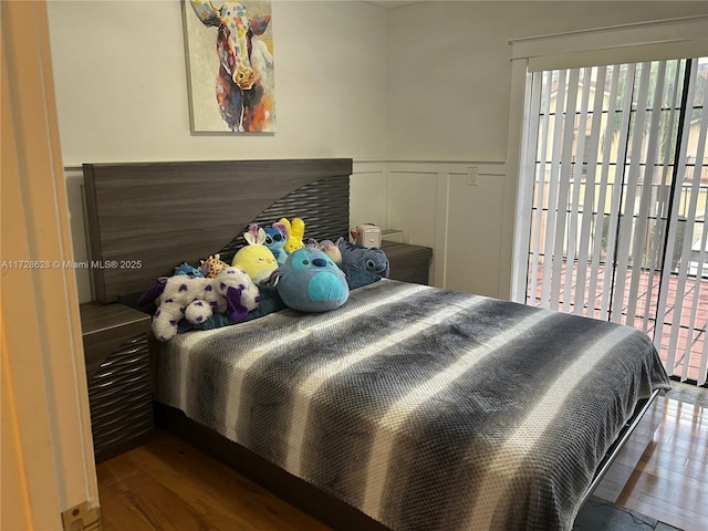 bedroom with hardwood / wood-style flooring