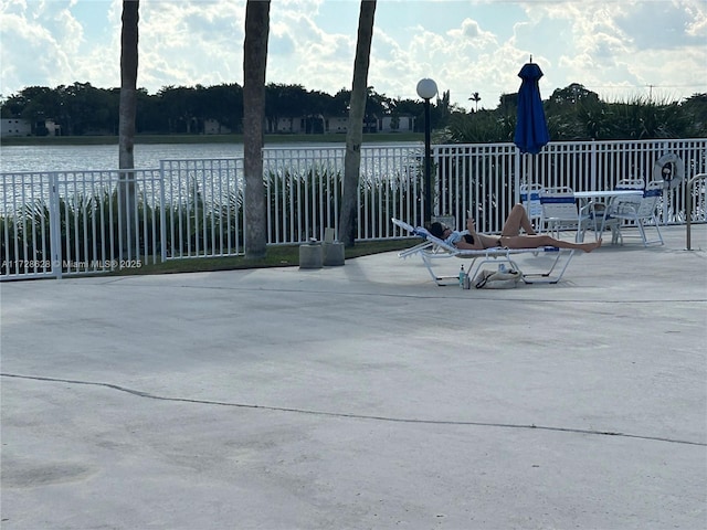 view of patio featuring a water view